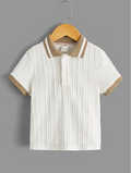 White textured polo shirt with brown trim on a hanger against a gray background